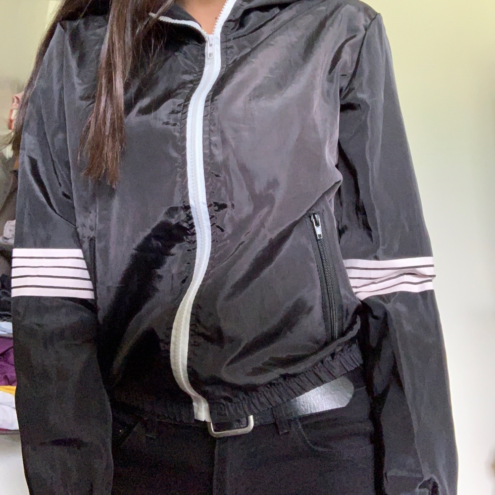 Black wind breaker with stripes on sleeves